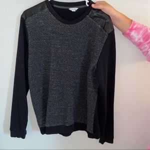 men's black crewneck w leather detail & texture.